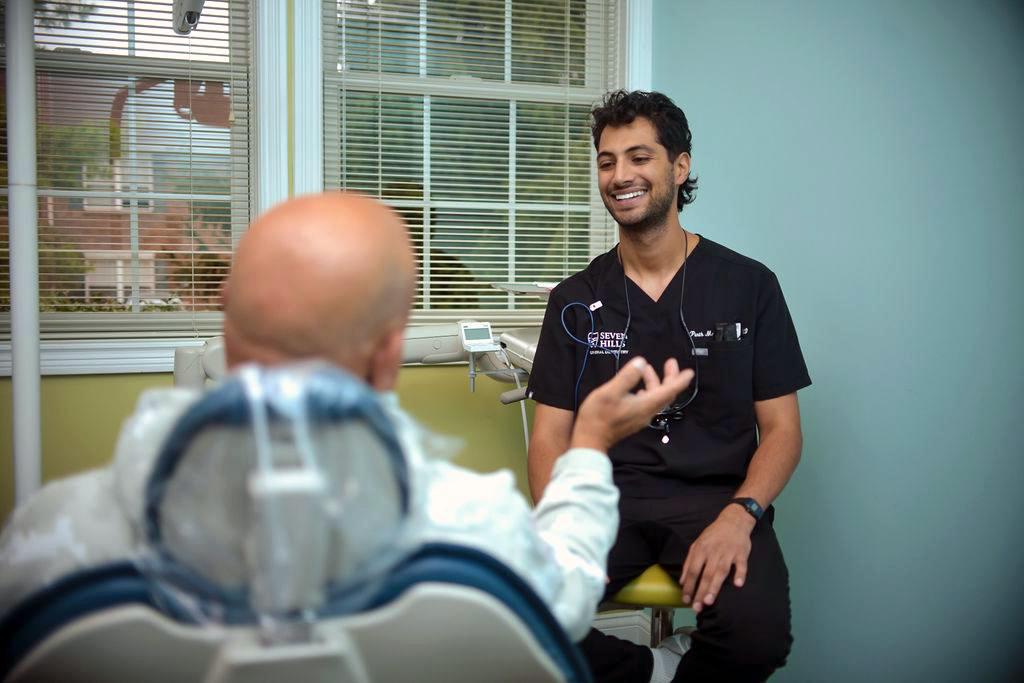 Dr. Parth Maheshwari talking with a patient at Seven Hills General Dentistry in Cincinnati